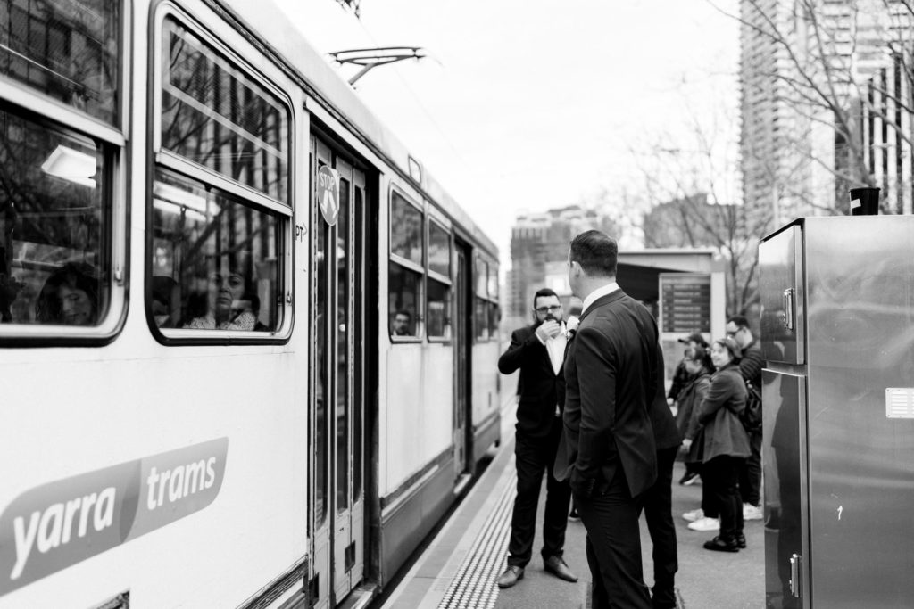 Groomsmen on the tram in Melbourne