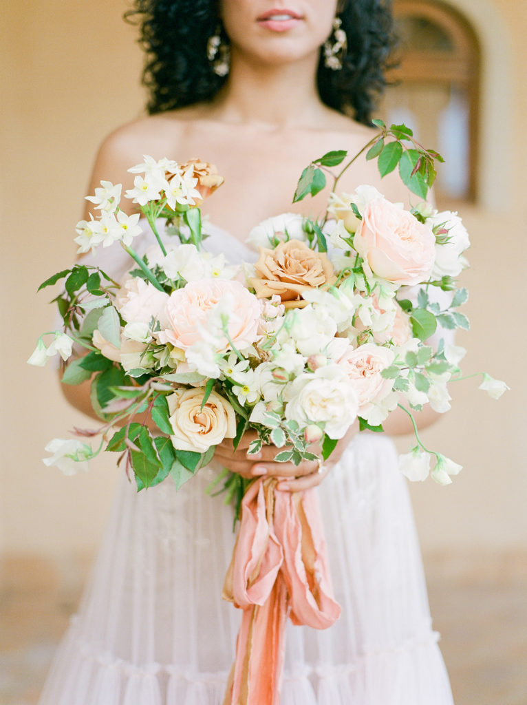 pastel orange and white bridal bouquet, shot on portra 800 film