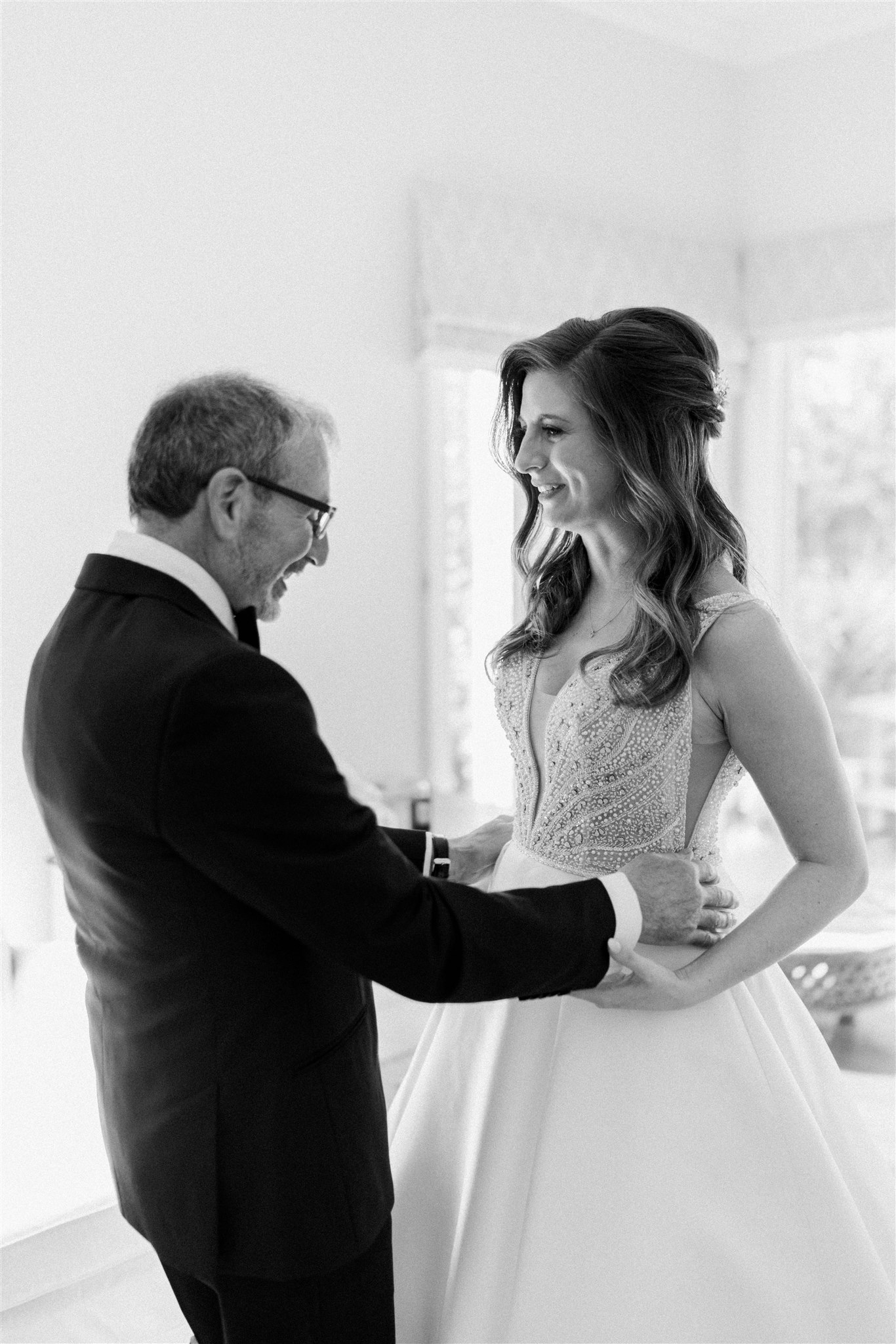 Bride has a first look with her father in her wedding dress
