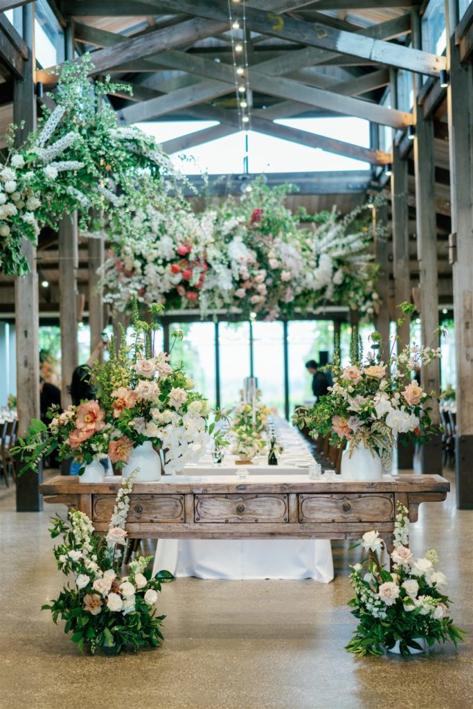 Reception table decorated with florals at Stones of the Yarra Valley