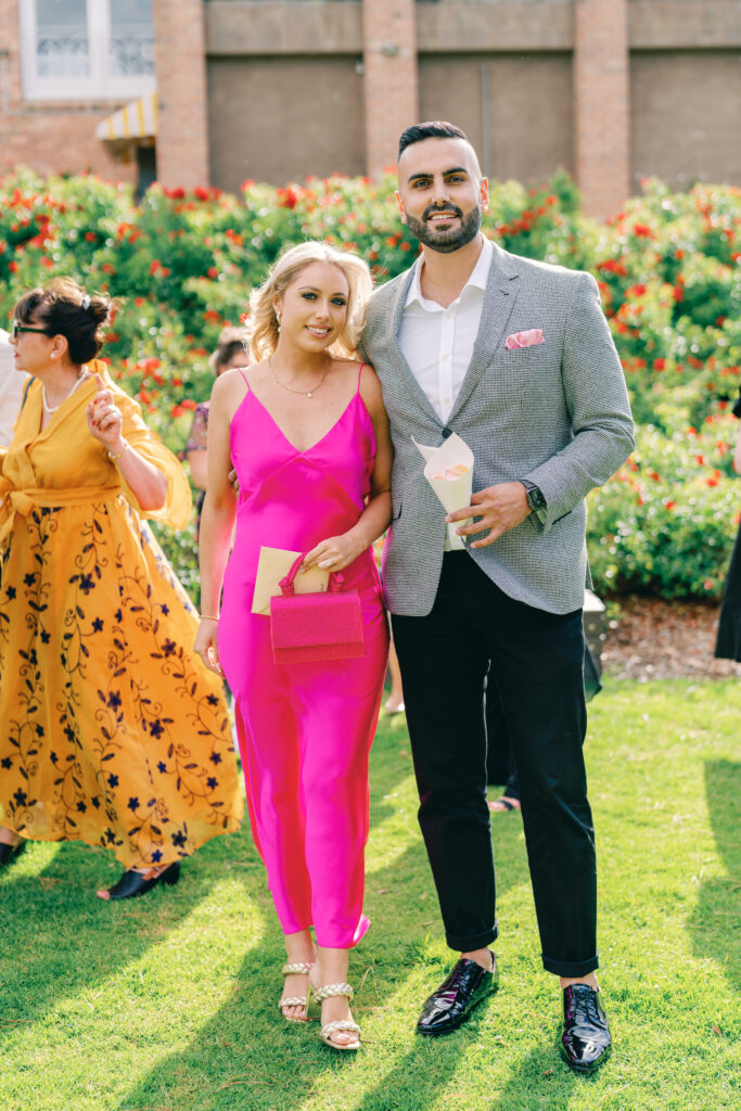 wedding guests wearing colourful dresses