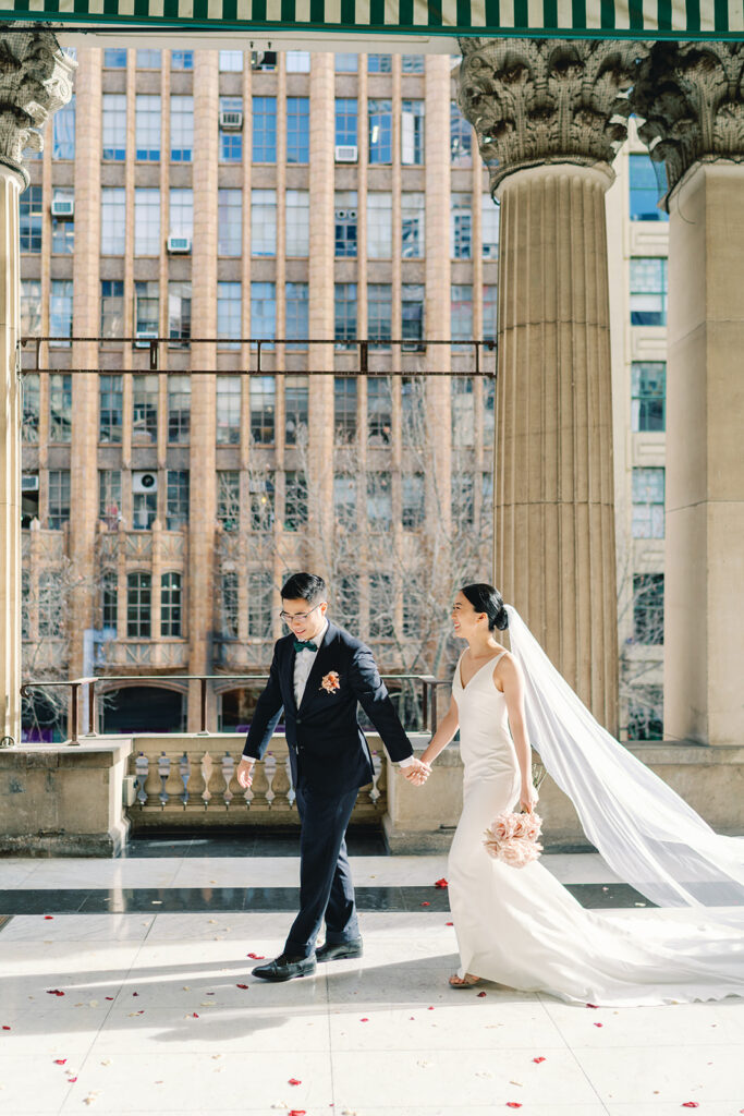 A bride & groom after their wedding ceremony at Melbourne town hall. the perfect Melbourne CBD wedding ceremony venue
